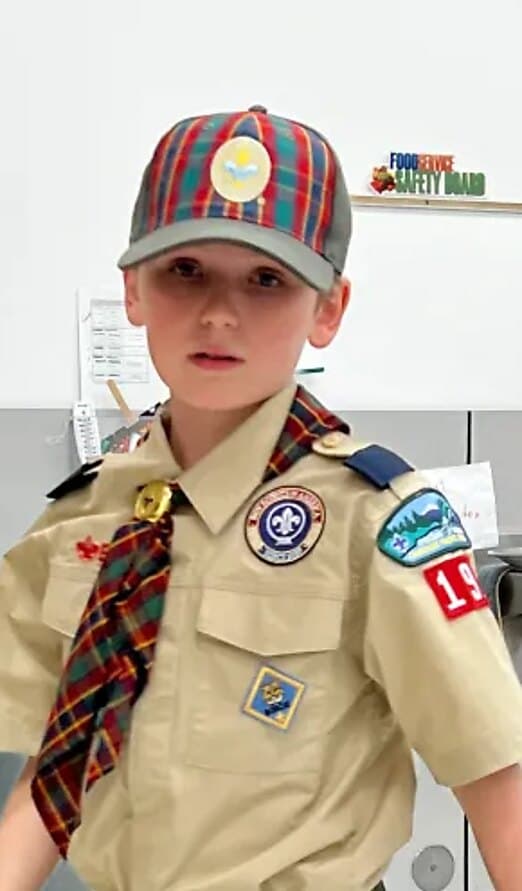 Asher in his Scouting America uniform